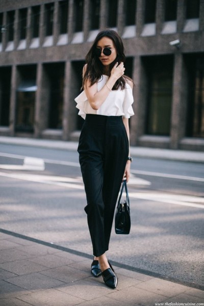 fashion blogger wearing monochrome outfit, white top with highwaisted trousers look