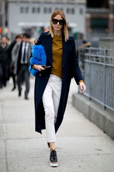 Cropped white jeans paired with long coat and platform flats.
