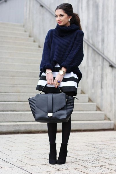 navy chunky sweater, black and white stripped skirt, black tights and booties