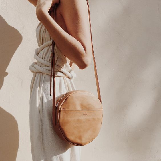 Simple geometric bag made of naturally milled, butter-soft leather.