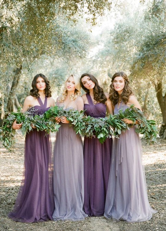 purple one shoulder dresses and grey lavender bridesmaids’ gowns
